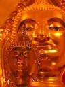 Tiny Buddhas usually surround the main Buddha image inside temples as does this little one in front of the giant bronze Buddha at Wat Traimit.